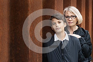 Good-looking, single-parent mom and teen son in the park. Photo photo