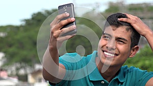 Good Looking Teen Boy Taking Selfy And Smiling