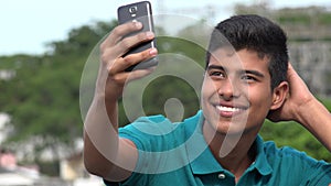 Good Looking Teen Boy Taking Selfy And Smiling