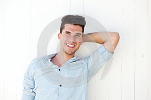 Good looking young man laughing outdoors