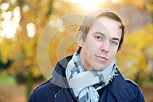 Good looking young man outdoors on a fall day