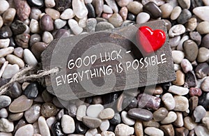 Good luck and everything is possible: greeting card with red heart for courage and convalescence. photo