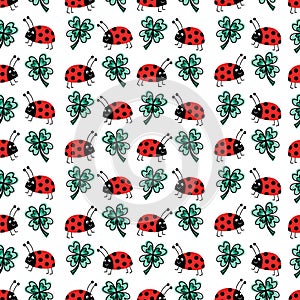 Good luck four-leaf clover and ladybug charms talisman seamless vector pattern. Repeating hand drawn fortune background. Use for