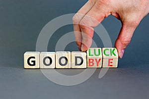 Good luck or goodbye symbol. Concept words Good luck or Goodbye on beautiful wooden blocks. Beautiful grey background. Businessman