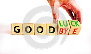 Good luck or goodbye symbol. Concept words Good luck or Goodbye on beautiful wooden blocks. Beautiful white background.