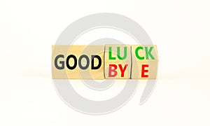 Good luck or goodbye symbol. Concept words Good luck or Goodbye on beautiful wooden blocks. Beautiful white table white background