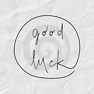 Good luck hand drawn lettering on white crumpled paper