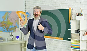 Good luck. Modern teacher lesson. Study and education. Modern school. Knowledge day. Handsome bearded man in classroom