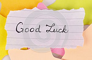 Good luck quote written on a paper