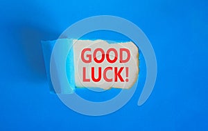 Good luck symbol. Concept words Good luck on beautiful white paper. Beautiful blue table blue background. Business, motivational