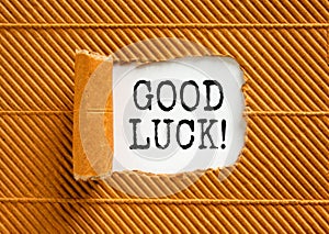 Good luck symbol. Concept words Good luck on beautiful white paper. Beautiful brown paper background. Business, motivational good