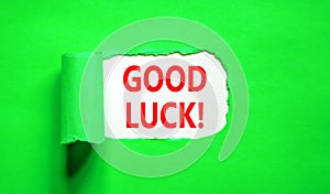 Good luck symbol. Concept words Good luck on beautiful white paper. Beautiful green table green background. Business, motivational