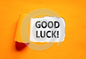 Good luck symbol. Concept words Good luck on beautiful white paper. Beautiful orange table orange background. Business,