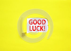 Good luck symbol. Concept words Good luck on beautiful white paper. Beautiful yellow paper background. Business, motivational good