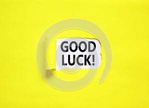 Good luck symbol. Concept words Good luck on beautiful white paper. Beautiful yellow paper background. Business, motivational good