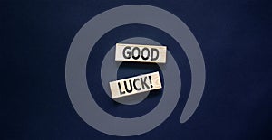 Good luck symbol. Concept words Good luck on beautiful wooden block. Beautiful black table black background. Business,