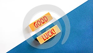 Good luck symbol. Concept words Good luck on beautiful wooden block. Beautiful white and blue background. Business, motivational