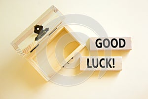 Good luck symbol. Concept words Good luck on beautiful wooden block. Beautiful white table white background. Empty wooden chest.