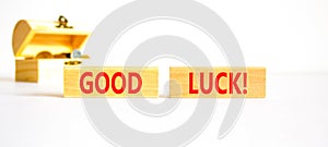 Good luck symbol. Concept words Good luck on beautiful wooden block. Beautiful white table white background. Wooden chest with