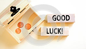 Good luck symbol. Concept words Good luck on beautiful wooden block. Beautiful white table white background. Wooden chest with