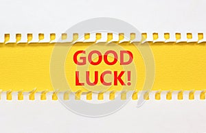 Good luck symbol. Concept words Good luck on beautiful yellow paper. Beautiful white paper background. Business, motivational good