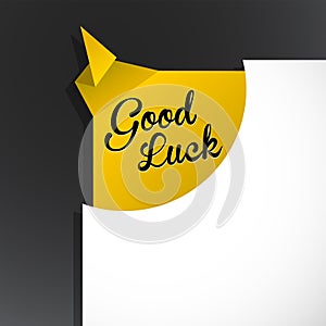 `Good Luck` text uncovered from torn paper corner.