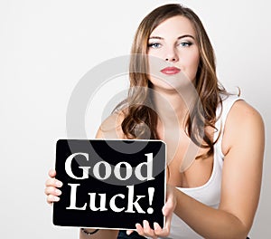 Good luck written on virtual screen. beautiful woman with bare shoulders holding pc tablet. technology, internet and