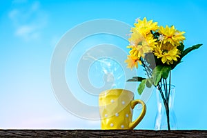 Good morning coffee and yellow flower vase