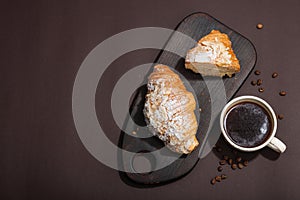 Good morning concept. Breakfast with cup of coffee and fresh croissant. Sweet creamy sauce