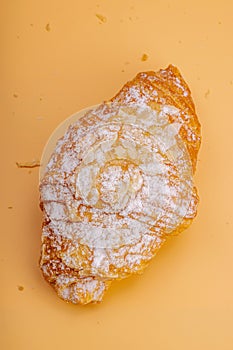 Good morning concept. Fresh croissants with cream filling and almond flakes. Sweet dessert