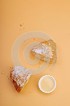 Good morning concept. Fresh croissants with cream filling and almond flakes. Sweet dessert