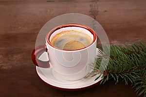 Good morning or Have a nice day Merry Christmas .Cup of coffee with cookies and fresh fir or pine branch