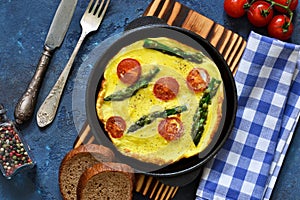 Good morning. Omelet with asparagus and tomatoes for breakfast