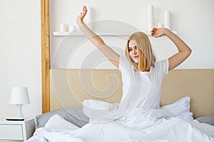 good morning rise and shine rested woman bedroom