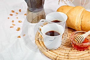 Good morning. Two cup of coffee with croissant and jam