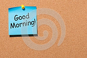 Good morning wishes in note pinned at office corkboard with empty space for text, mockup or template