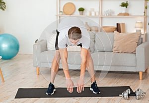 Good morning and workout. Muscular guy tilts and does warm-up photo