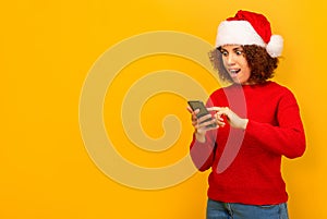 Good news, discounts, online shopping. Pleasantly surprised woman reading message on mobile phone