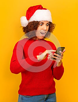 Good news discounts online shopping Pleasantly surprised woman reading message on mobile phone about big christmas sales