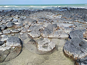 A good place for leisure and vacation scenes of black stone beach at Kuantan Pahang Malaysia.