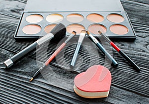 Good quality cosmetics on the wood table in studio