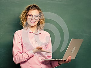 good results. teacher woman at blackboard. happy student in glasses with computer. modern technology. girl in modern