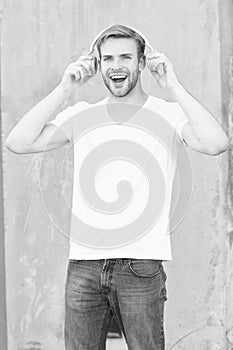 Good sound for happy experience. Happy man listen to music grey background. Handsome guy enjoy happy melody playing in