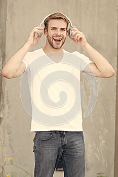 Good sound for happy experience. Happy man listen to music grey background. Handsome guy enjoy happy melody playing in