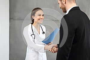 Good test results. Smiling doctor communicating information to the patient.