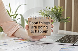 Good Things Are Going To Happen Inspirational message written on vintage wooden board. Motivation concept image