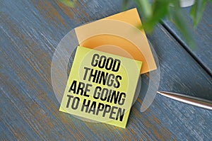 Good Things Are Going To Happen Inspirational message written on vintage wooden board. Motivation concept image