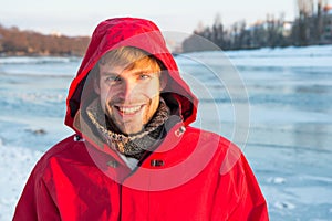 Good time. hooded anorak. travel and expedition concept. man in red parka. winter male fashion. warm clothes for cold
