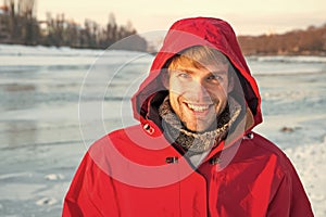 Good time. hooded anorak. travel and expedition concept. man in red parka. winter male fashion. warm clothes for cold