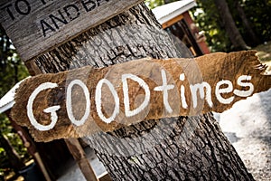 Good Times sign on wooden board